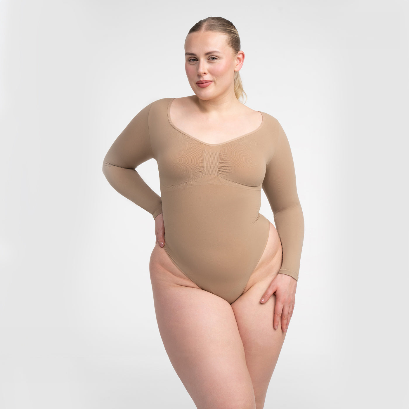 <tc>Body modellante a maniche lunghe con perizoma</tc>