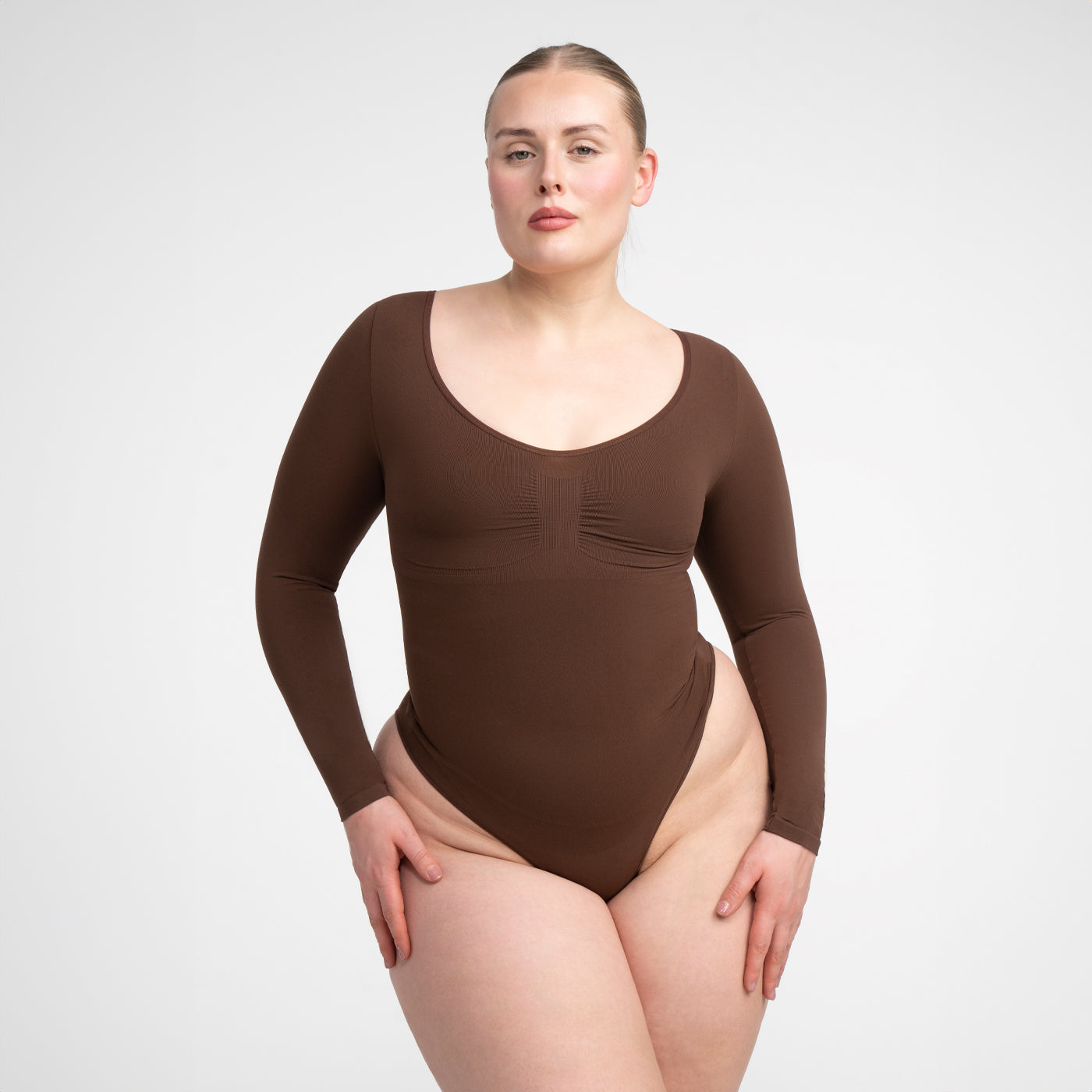 <tc>Body modellante a maniche lunghe con perizoma</tc>