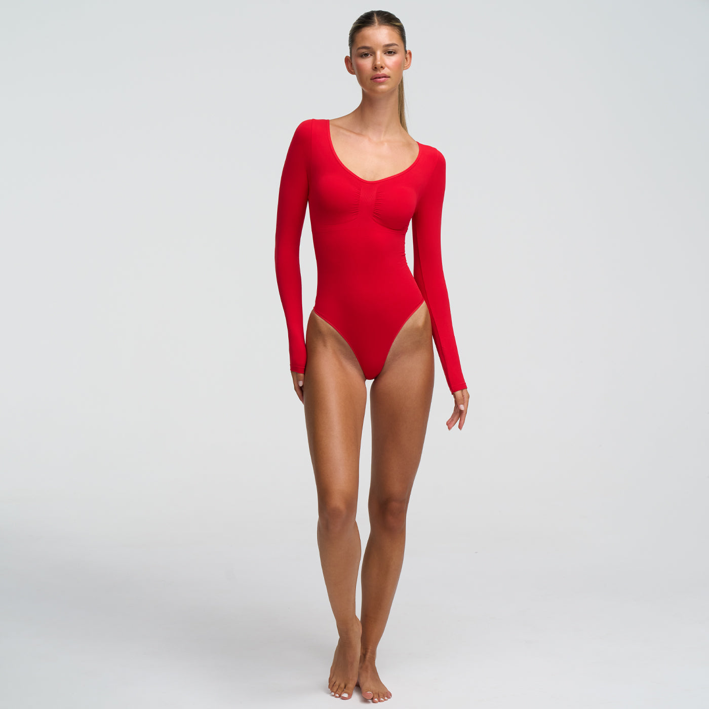 <tc>Body modellante a maniche lunghe con perizoma</tc>